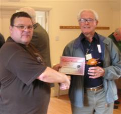 The monthly winner Frank Hayward received his certificate From Nick Arnull 